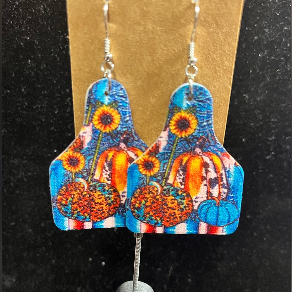 Cow tag pumpkin leather earrings NWT